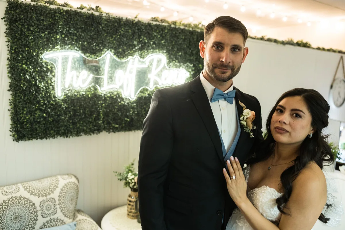 Just married, beside The Loft Reno sign